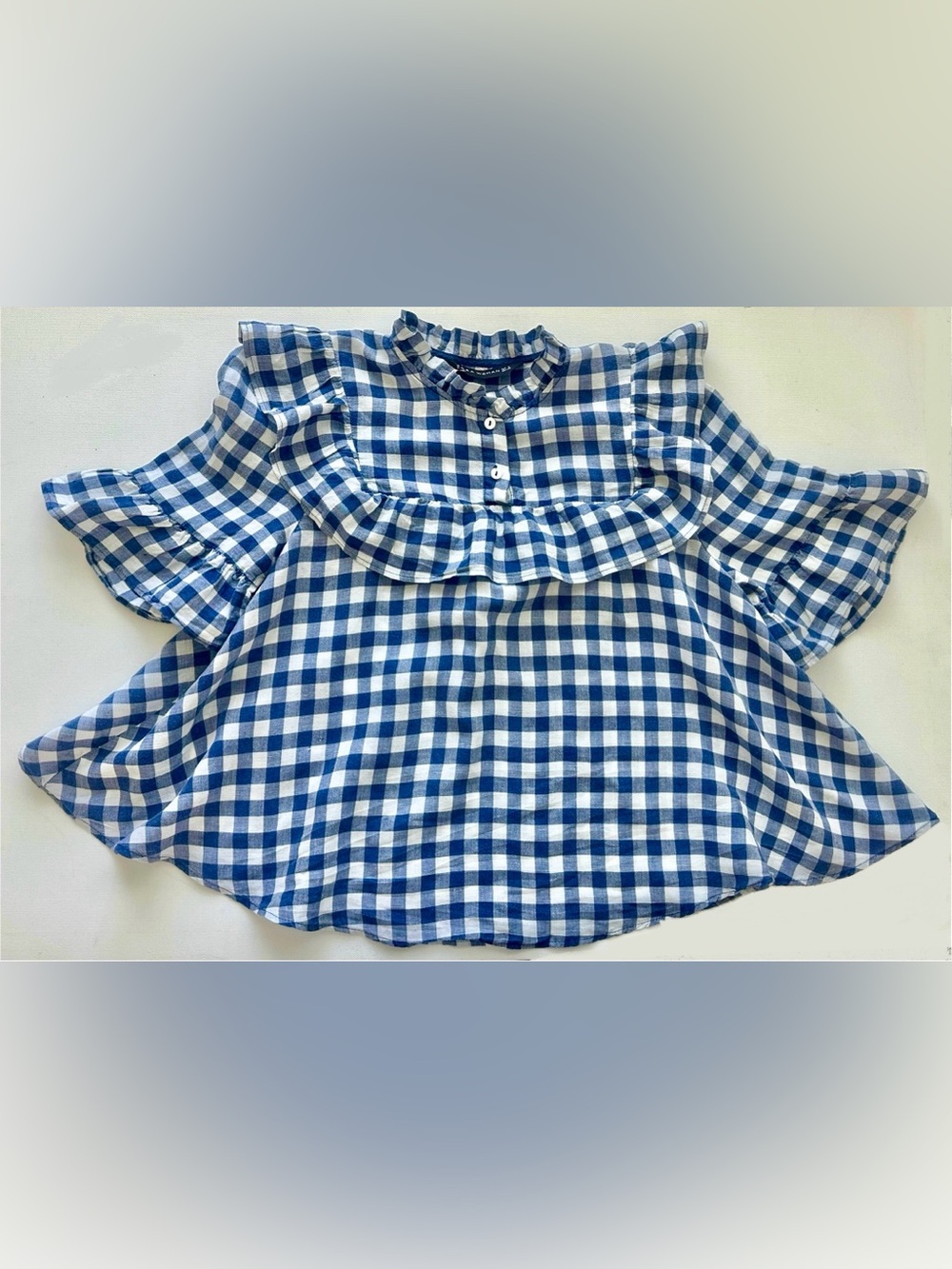 Zara Women’s blouse with a high stand collar, prominent u-shaped ruffle. Zara S